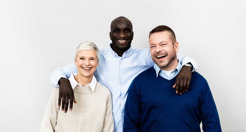 Three people hugging